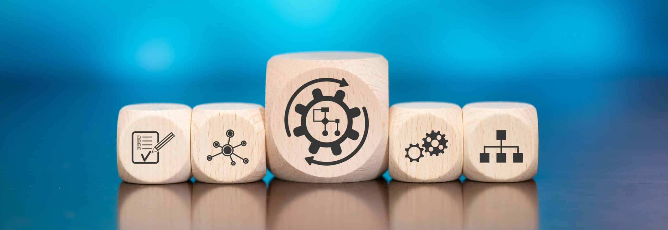 Wooden,Blocks,With,Symbol,Of,Workflow,Concept,On,Blue,Background